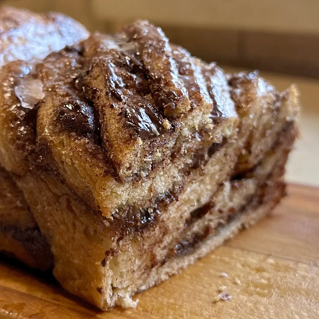Cinnamon Babka. Soft, fluffy yeast babka filled with cinnamon, butter and brown sugar, finished with a sugar syrup glaze.